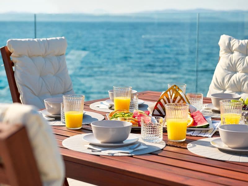 Outdoor dining area with spectacular Adriatic Sea view, beachfront holiday rental