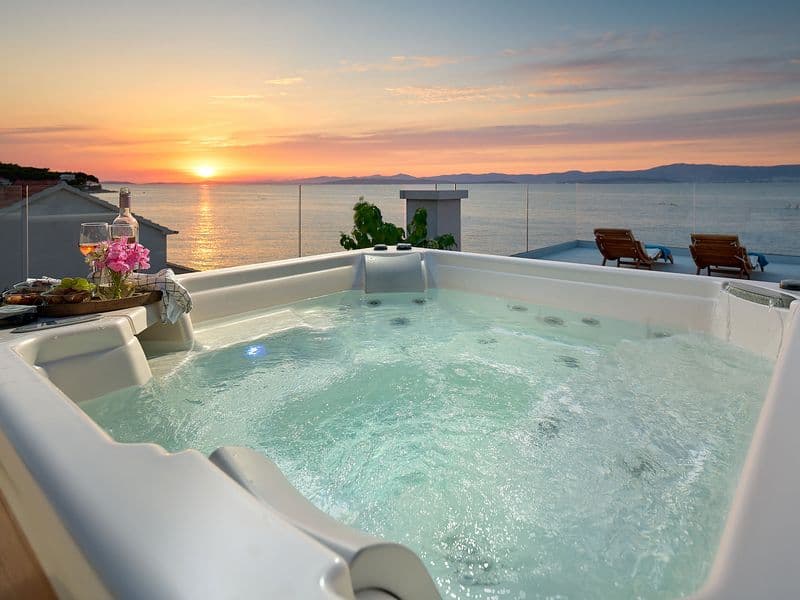 Luxury outdoor jacuzzi on terrace with sunset sea view-Dalmakeys