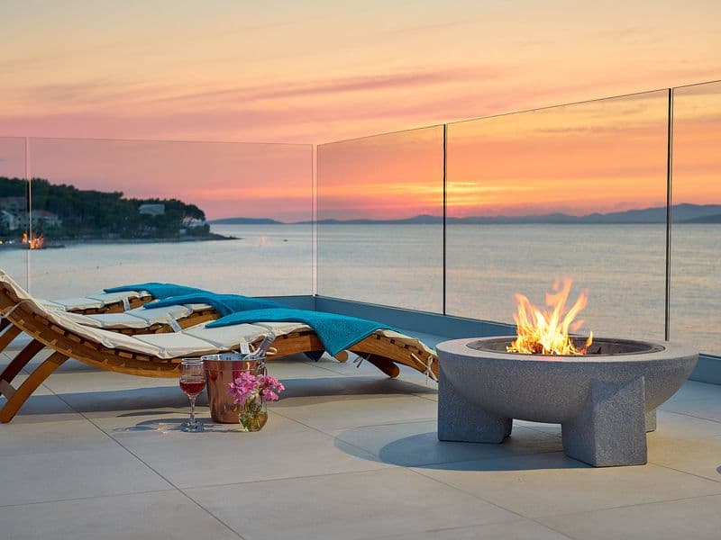 Modern sunbeds on luxury terrace at night, Croatia holiday rentals